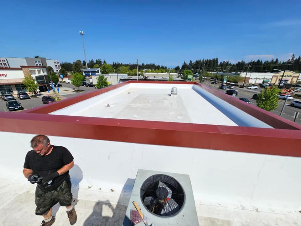 a man is working on the roof of a building .