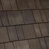 A close up of a row of white shingles on a roof.