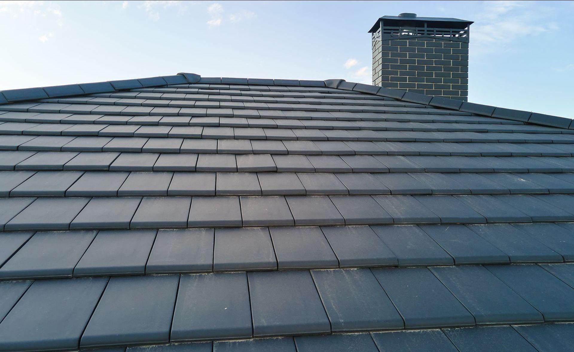 A roof with a chimney on top of it from Washington Roofing Services near Arlington WA